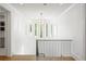 Elegant landing area with modern chandelier and row of windows providing ample natural light at 5260 Long Island Nw Dr, Atlanta, GA 30327