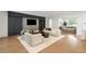 Expansive living room featuring a large TV, stylish seating, and sleek design at 5260 Long Island Nw Dr, Atlanta, GA 30327
