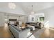 Expansive living area flowing into kitchen, featuring modern decor and hardwood floors at 5260 Long Island Nw Dr, Atlanta, GA 30327