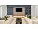 Modern living room with sleek furniture, a stylish entertainment center, and contemporary decor at 5260 Long Island Nw Dr, Atlanta, GA 30327
