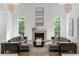 Bright living room with a fireplace, comfortable sofas, and plenty of natural light at 5260 Long Island Nw Dr, Atlanta, GA 30327
