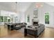 Open-concept living area with vaulted ceilings, modern furnishings, and hardwood floors at 5260 Long Island Nw Dr, Atlanta, GA 30327