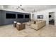 Expansive living room with multiple screens, comfortable seating, and modern lighting, perfect for entertainment at 5260 Long Island Nw Dr, Atlanta, GA 30327