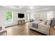 Spacious main bedroom features hardwood floors, tray ceiling, and large windows overlooking the greenery at 5260 Long Island Nw Dr, Atlanta, GA 30327