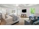 Large main bedroom offers a sitting area, TV, and stylish decor for comfortable living at 5260 Long Island Nw Dr, Atlanta, GA 30327