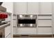 Sleek, stainless steel Wolf microwave installed in custom cabinetry at 5260 Long Island Nw Dr, Atlanta, GA 30327