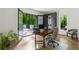 Office space with hardwood floors and glass doors leading to the outdoor patio with scenic view at 5260 Long Island Nw Dr, Atlanta, GA 30327