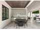 Stylish outdoor kitchen featuring modern appliances, a dining area, and ample counter space at 5260 Long Island Nw Dr, Atlanta, GA 30327