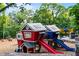 Charming playground with colorful playhouses and slides, offering a fun and imaginative space for children to play at 5260 Long Island Nw Dr, Atlanta, GA 30327