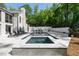 A backyard pool and hot tub features a brick wall and patio area perfect for entertaining at 5260 Long Island Nw Dr, Atlanta, GA 30327