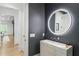 Modern powder room with stylish lighting fixture, marble sink, and sleek design at 5260 Long Island Nw Dr, Atlanta, GA 30327