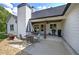 Rear exterior and partially covered patio of home showing a grill at 613 Nebo Rd, Dallas, GA 30157