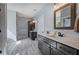Spacious bathroom with a double vanity sink and view into the shower and tub area at 613 Nebo Rd, Dallas, GA 30157