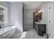 Bathroom with a soaking tub and glass enclosed shower at 613 Nebo Rd, Dallas, GA 30157