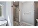 Modern bathroom featuring glass enclosed shower with gray subway tile and a built-in bench at 613 Nebo Rd, Dallas, GA 30157