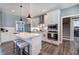 Modern kitchen featuring white cabinetry, a central island, and stainless steel appliances at 613 Nebo Rd, Dallas, GA 30157