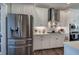 Bright kitchen with stainless steel appliances, white cabinets, and ample counter space at 613 Nebo Rd, Dallas, GA 30157