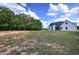 Spacious lot with home in the background, providing an overview of the property's generous outdoor space at 613 Nebo Rd, Dallas, GA 30157