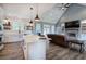 Open-concept living room showcasing a modern kitchen, fireplace, and comfortable seating at 613 Nebo Rd, Dallas, GA 30157