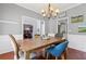 Comfortable dining room featuring hardwood floors, stylish decor, and natural light at 893 Brookgreen Pl, Lawrenceville, GA 30043
