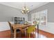 Cozy dining room with hardwood floors and a window letting in natural light at 893 Brookgreen Pl, Lawrenceville, GA 30043