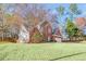 Beautiful home featuring a well-maintained lawn and a classic brick facade at 893 Brookgreen Pl, Lawrenceville, GA 30043