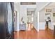 Bright foyer with hardwood floors and view into kitchen and dining room at 893 Brookgreen Pl, Lawrenceville, GA 30043