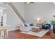 Cozy living room with staircase view, hardwood floors, and a fireplace feature at 893 Brookgreen Pl, Lawrenceville, GA 30043