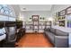 Well-lit office featuring a large window, hardwood floors, and ample shelving at 893 Brookgreen Pl, Lawrenceville, GA 30043