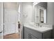 Modern bathroom with white quartz counters and gray cabinetry at 225 Farmbrooke Ct, Sandy Springs, GA 30350