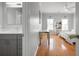 Spacious bedroom with hardwood floors, a ceiling fan, and a view of the connected bathroom at 225 Farmbrooke Ct, Sandy Springs, GA 30350