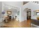 Spacious foyer showcasing hardwood floors, high ceilings, grand piano, and an open-concept layout at 225 Farmbrooke Ct, Sandy Springs, GA 30350