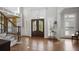 Grand foyer boasts hardwood floors, decorative staircase, and elegant stained glass double-door entrance at 225 Farmbrooke Ct, Sandy Springs, GA 30350
