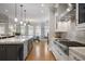 Modern kitchen with granite countertops, stainless appliances, and hardwood floors at 225 Farmbrooke Ct, Sandy Springs, GA 30350