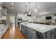Kitchen with stainless steel appliances, an island, and hardwood floors at 225 Farmbrooke Ct, Sandy Springs, GA 30350