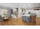 An open kitchen layout with an island, modern appliances, and a dining area at 225 Farmbrooke Ct, Sandy Springs, GA 30350