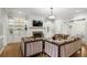 Bright living room with built-in shelves, fireplace, hardwood floors, and modern decor at 225 Farmbrooke Ct, Sandy Springs, GA 30350