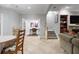 Open concept living room with tile floors, staircase, dining area, and access to the backyard at 225 Farmbrooke Ct, Sandy Springs, GA 30350
