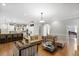 Spacious living room featuring hardwood floors, stylish furniture, and open concept at 225 Farmbrooke Ct, Sandy Springs, GA 30350