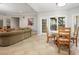 Spacious living room with tile floors, neutral walls, a dining area, and natural light at 225 Farmbrooke Ct, Sandy Springs, GA 30350