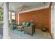 Comfortable outdoor porch with cozy seating arrangement, perfect for enjoying the fresh air and relaxing at 225 Farmbrooke Ct, Sandy Springs, GA 30350
