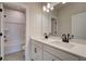 Modern bathroom featuring double sink vanity with sleek faucets, cabinets and large mirror at 4730 Montane St, Cumming, GA 30028