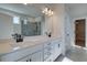 Bright bathroom with a double vanity, shower, and walk-in closet at 4730 Montane St, Cumming, GA 30028