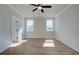 Neutral bedroom with hardwood floors, ceiling fan, and natural lighting at 4730 Montane St, Cumming, GA 30028