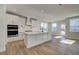 Bright kitchen with white cabinets, a central island, stainless steel appliances, and recessed lighting at 4730 Montane St, Cumming, GA 30028