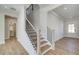 Staircase with metal railings and wood treads leading to the upper level at 4730 Montane St, Cumming, GA 30028