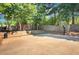 Community basketball court next to playground featuring court and basketball hoop at 5410 Lenox Park Pl, Buford, GA 30518