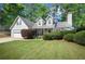 Charming home with a well-manicured lawn and landscaping for a welcoming curb appeal at 5410 Lenox Park Pl, Buford, GA 30518