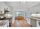 Well-equipped kitchen boasts stainless steel appliances, ample countertop space, and stylish cabinets, creating a functional area at 5410 Lenox Park Pl, Buford, GA 30518