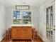 Charming kitchen island with seating, perfect for casual dining, complemented by natural light and functional design elements at 5410 Lenox Park Pl, Buford, GA 30518